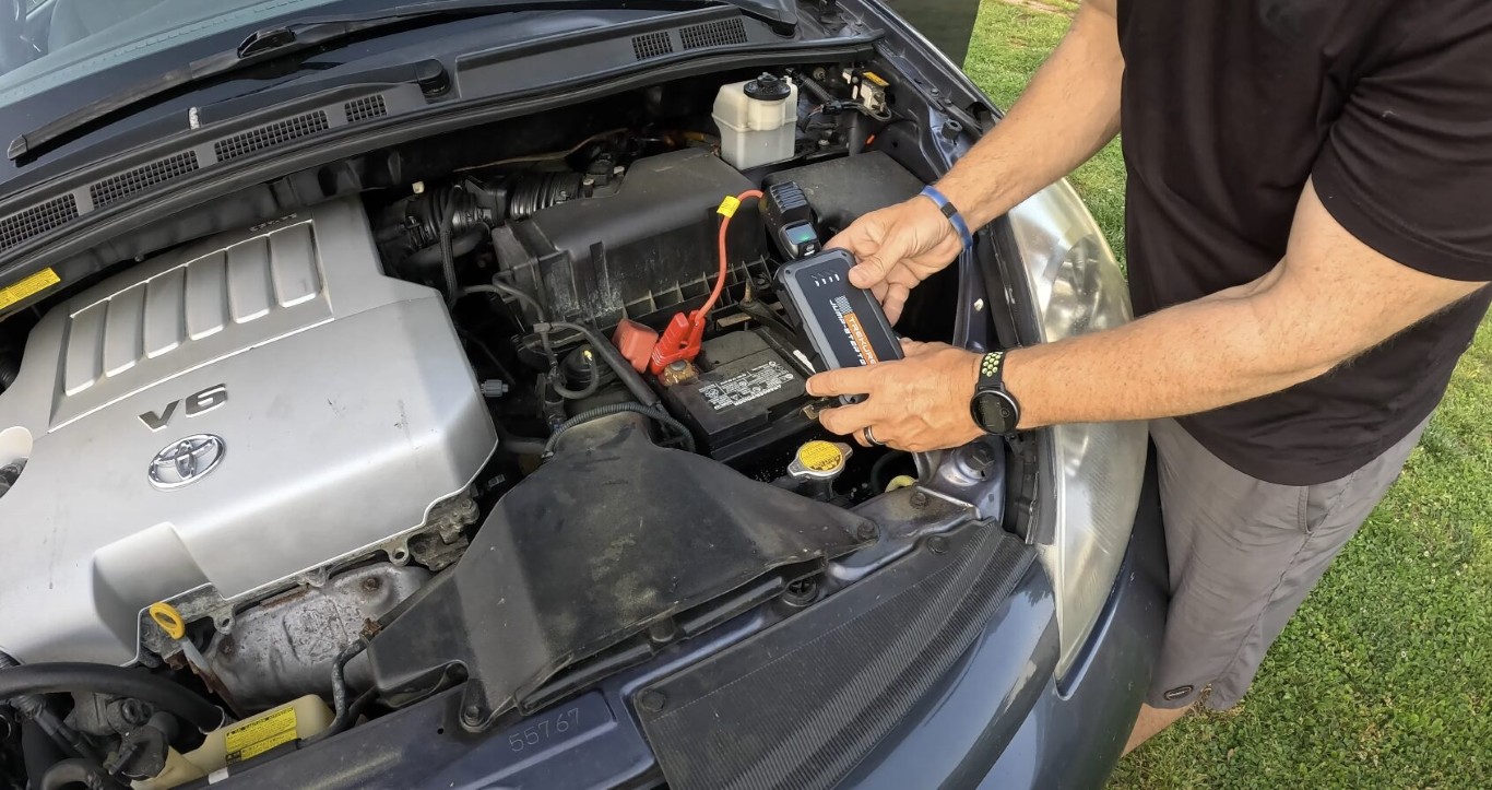 Professional roadside assistance technician providing battery jump service in Pembroke Pines, FL